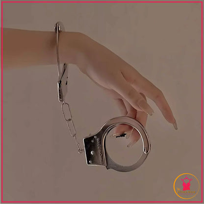 Adjustable metallic roleplay cuffs with matching keys
